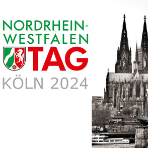 Kölner Dom und Rheinbrücke sw mit NRW Tag Werbung bunt